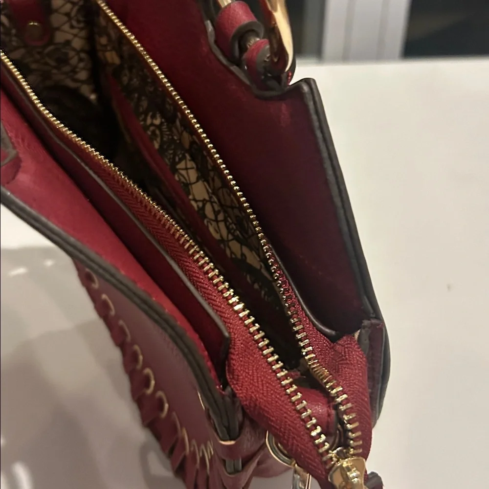 Carlos Santana faux pebbled leather maroon western crossbody bag laser cut rings